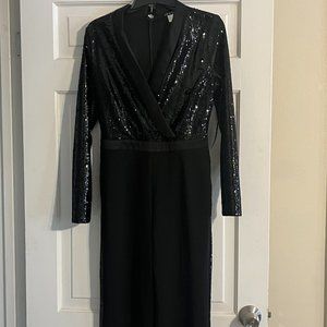 Black sequin tuxedo style jumpsuit. Special occasions.